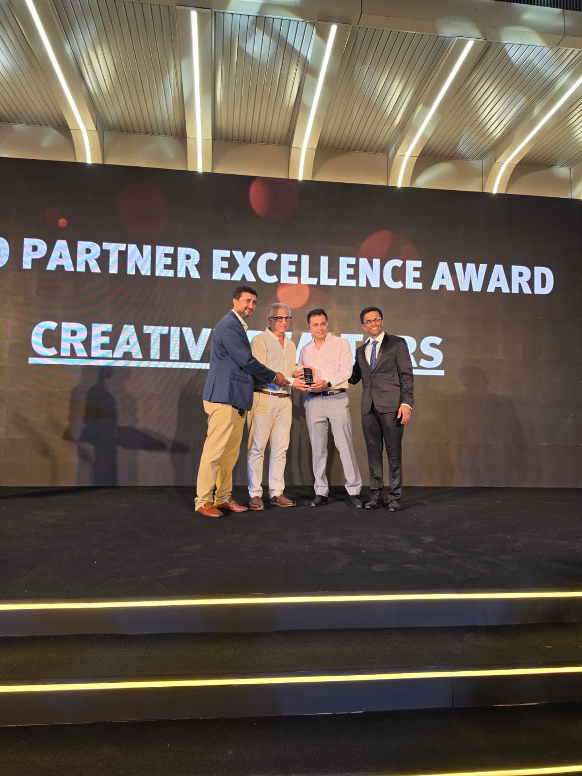 Creative Realtors receiving a partner excellence award